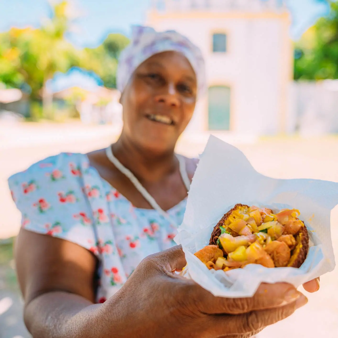 One of our Tour Guides giving our guests some of the food on this Food Tour
