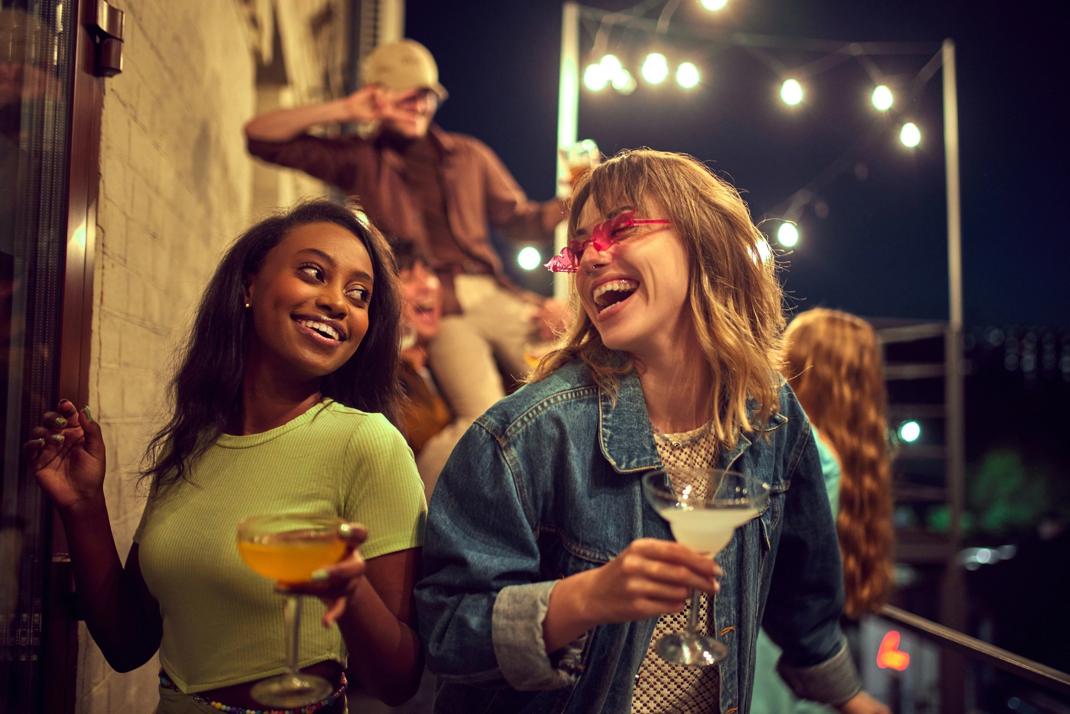 Two women enjoying a Cocktail on one of our Austin Pub Crawls.